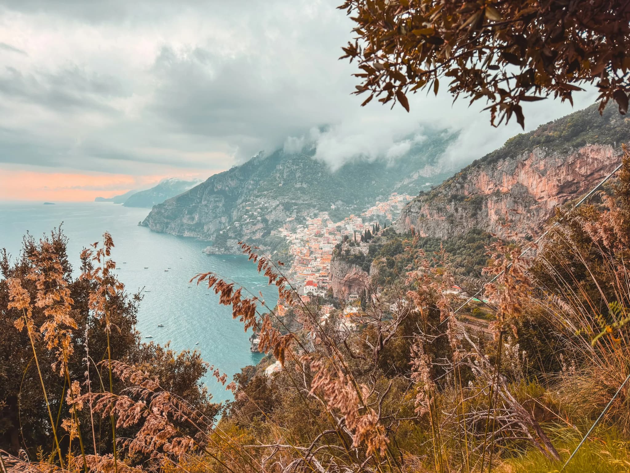 Positano seen from the Path of the Gods, through dry branches