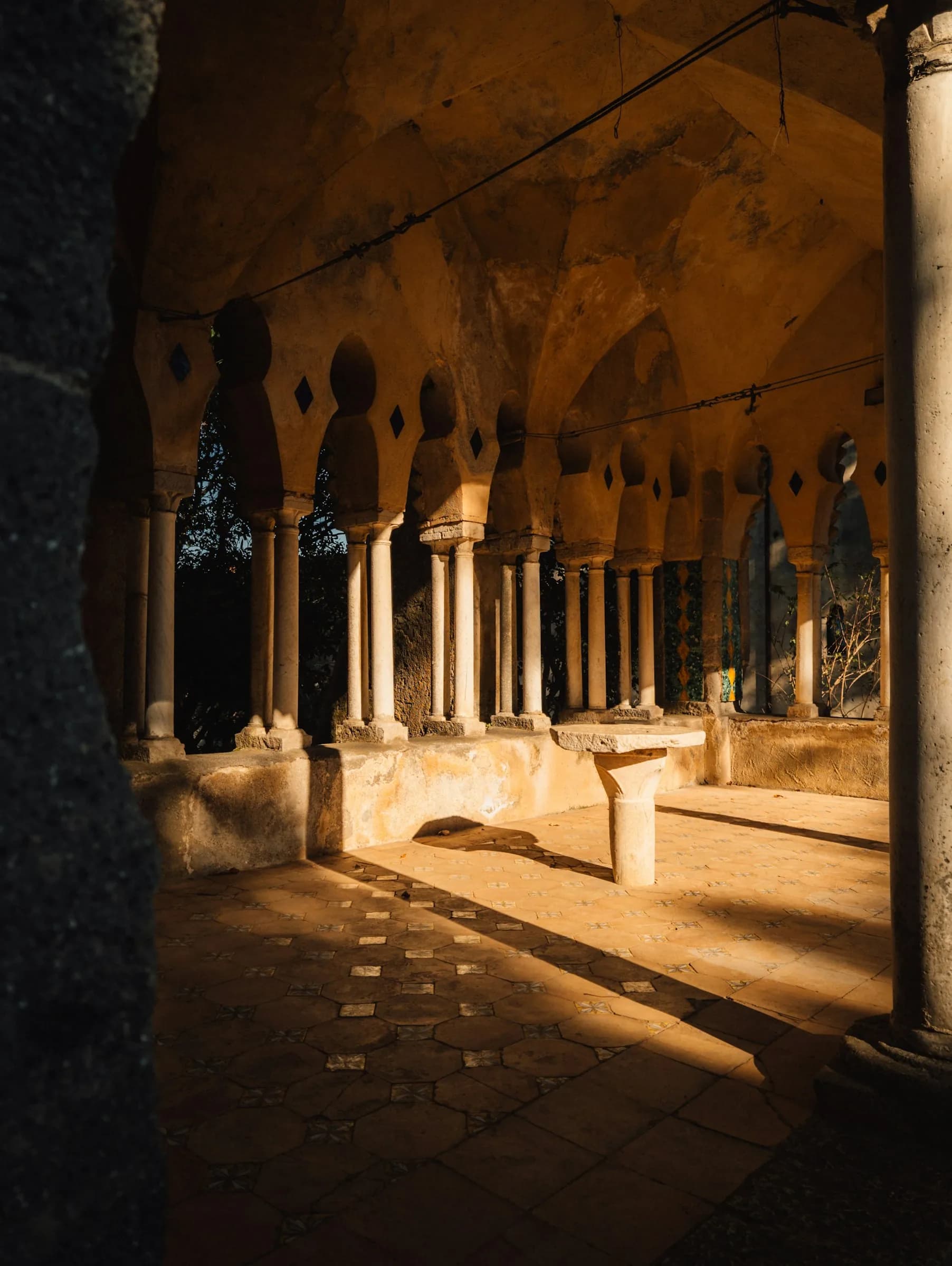 The Cloister of Paradise in Amalfi, low light between the arches