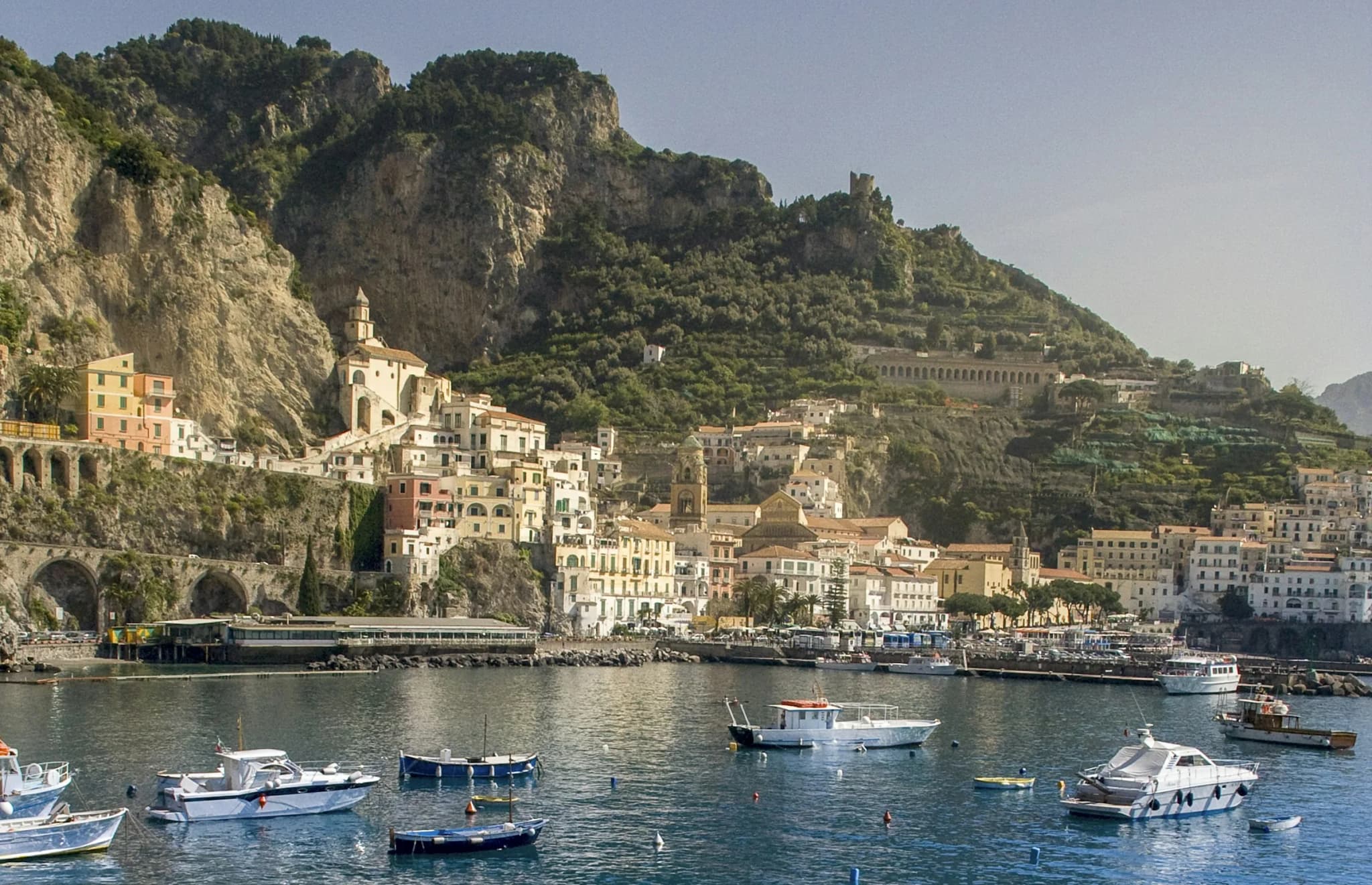 Amalfi harbour, fishing boats in front of the town