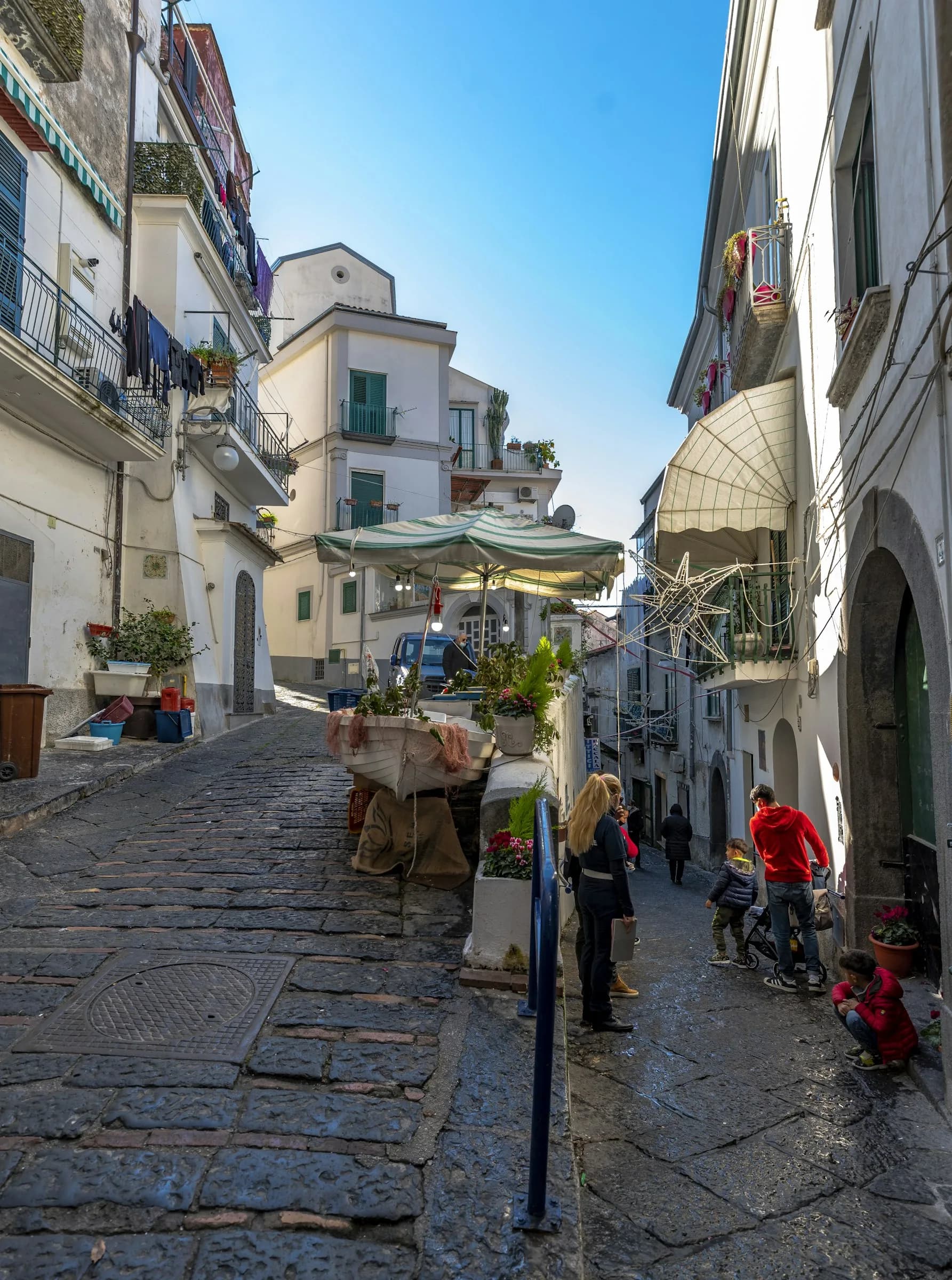 An uphill street in Vietri, between workshops and balconies